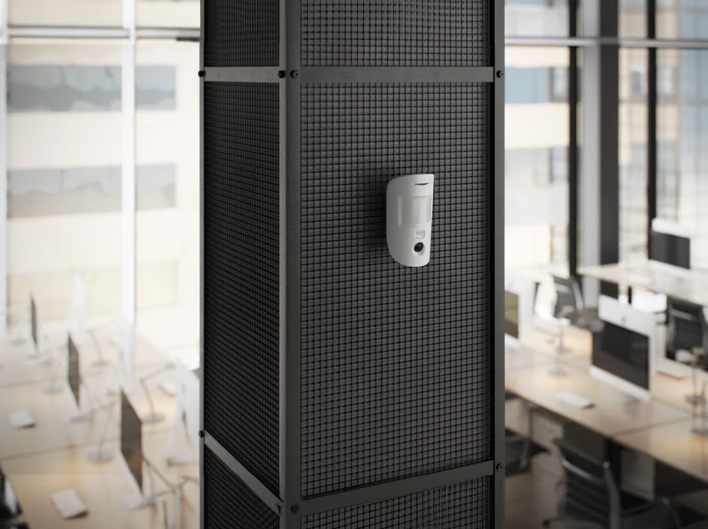 White Device Mounted on a Dark Metal Mesh Column in an Office Setting — Cussler NQ in Cannonvale, QLD