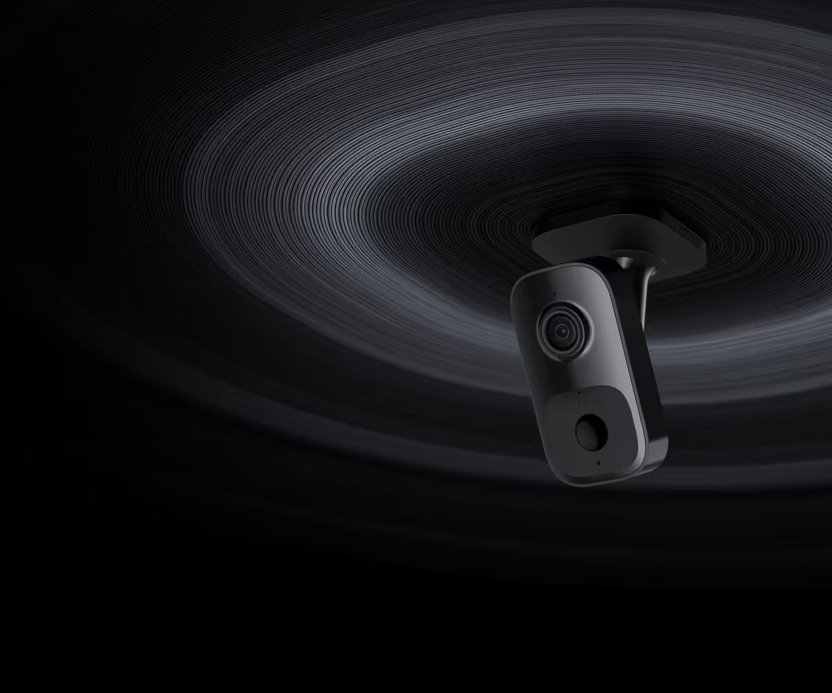 Security Camera Mounted on a Dark Ceiling; Circular Light Pattern Around It — Cussler NQ in Bowen, QLD