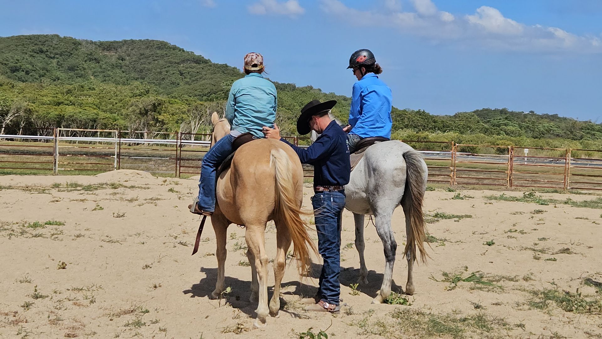 Two People On A Horse With A Man Standing In Between Them — Jono Battle Equine Services In Charters Towers, QLD