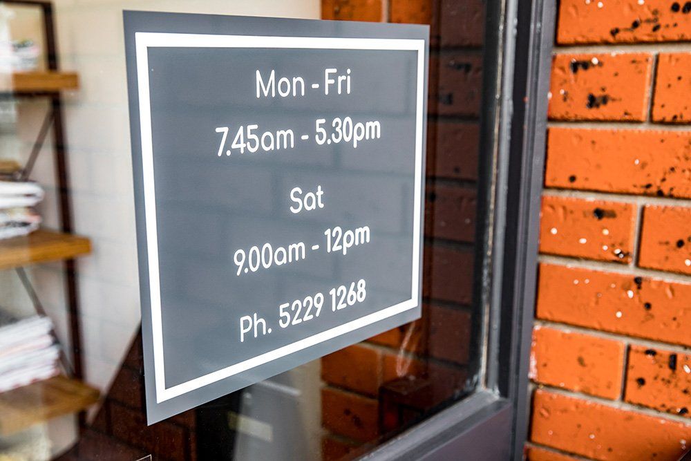 mitts dry cleaners hours of operation sign