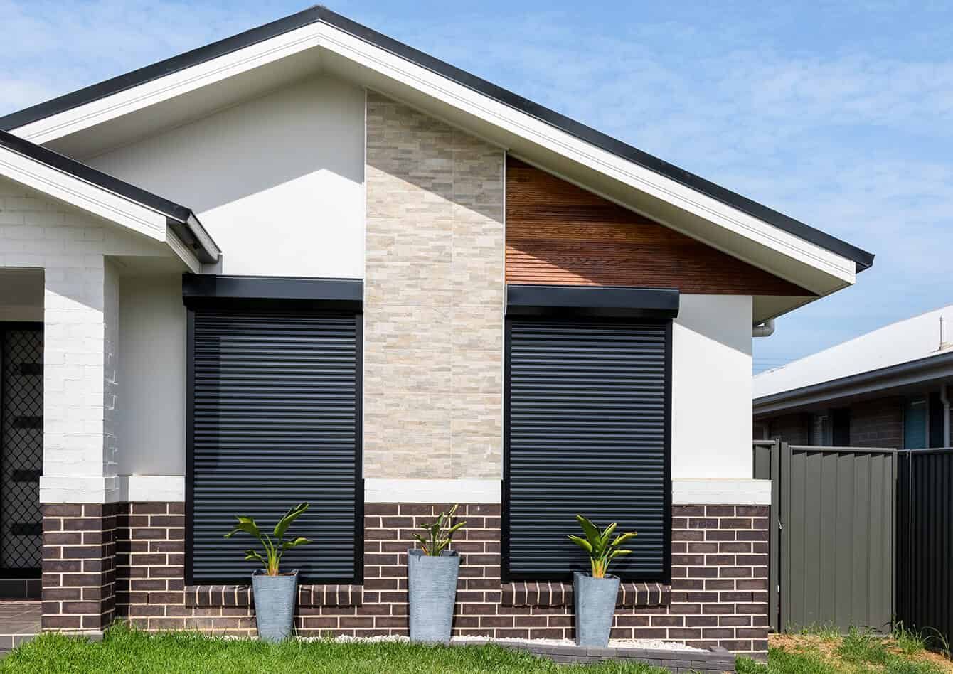 A Stylish House With A Few Potted Plants — Southern Blinds & Awnings In Balaclava NSW