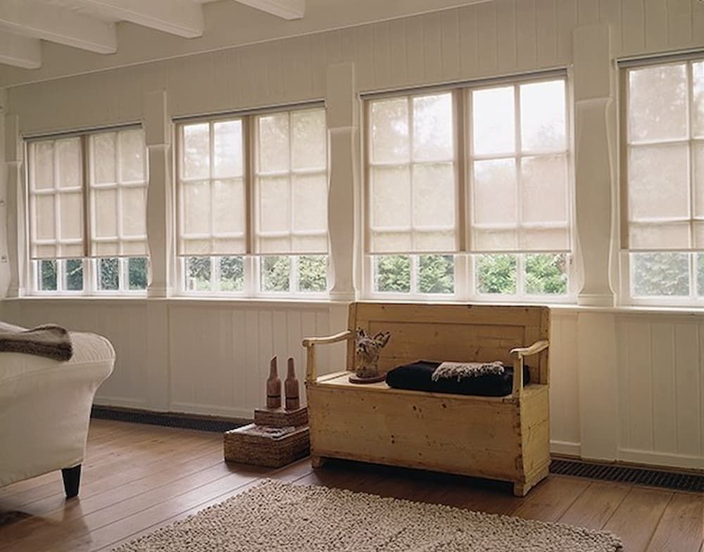 Bright Room With Large Windows Covered by Sheer Curtains