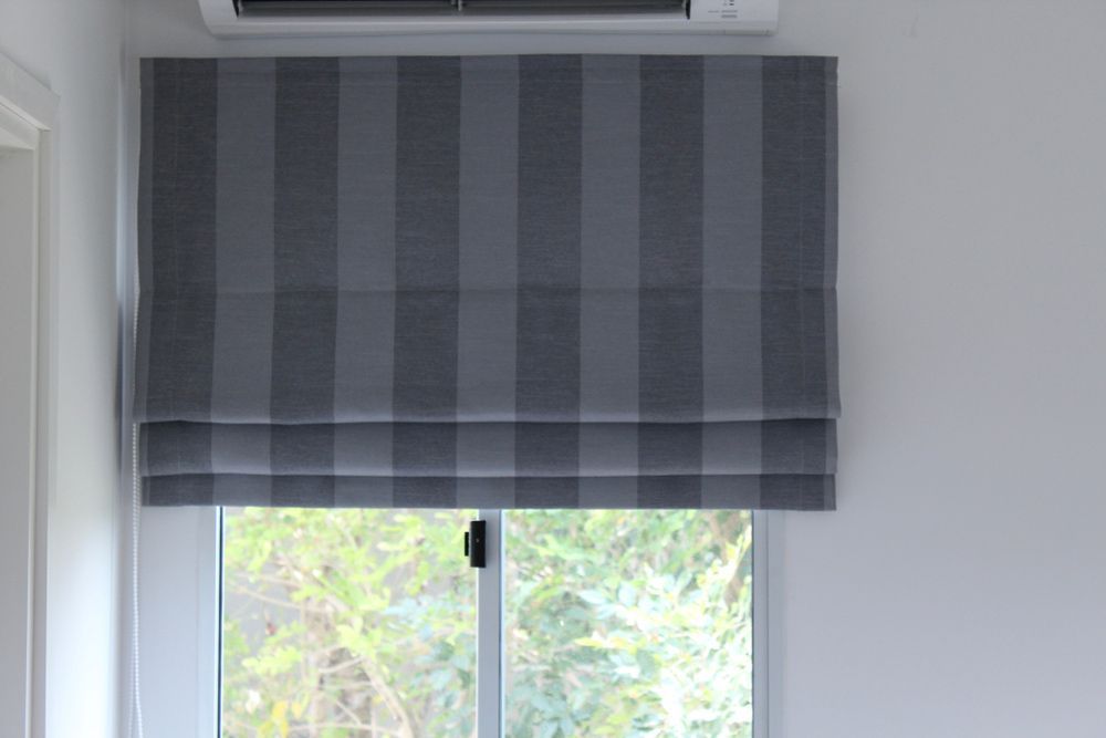 Stylish Grey Roman Blind with Striped Pattern Adorning the Window — Southern Blinds & Awnings In Moss Vale NSW
