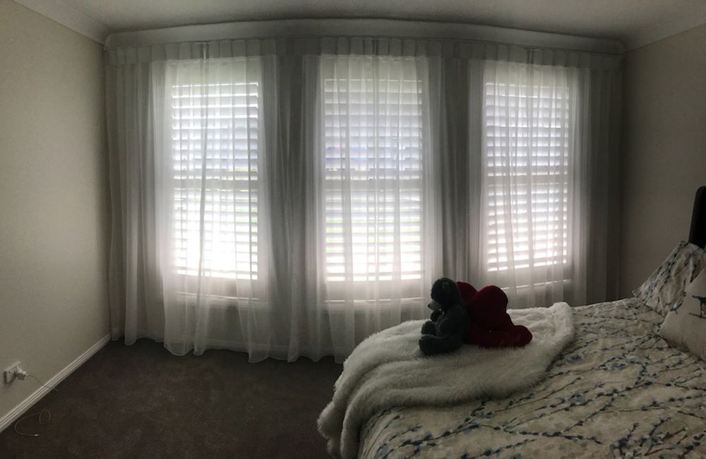 Timber Painted Shutters Paired with Box Pleat Sheer to Soften Main Bed — Southern Blinds & Awnings In Balaclava NSW
