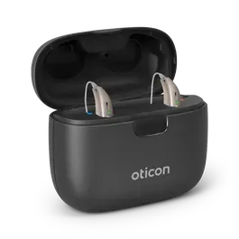 Pair of beige Oticon hearing aids in a black charging case.