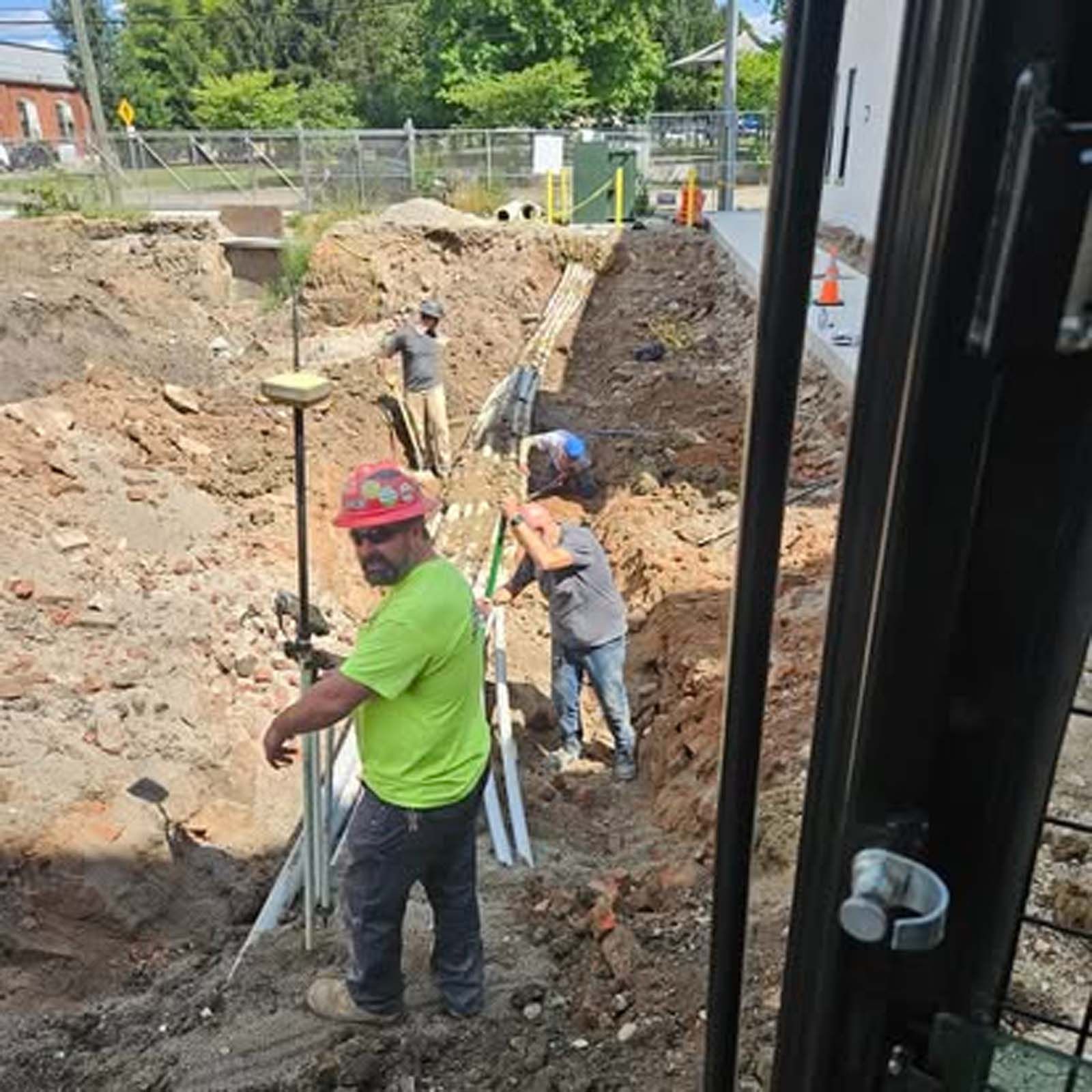A group of construction workers are working on a construction site.