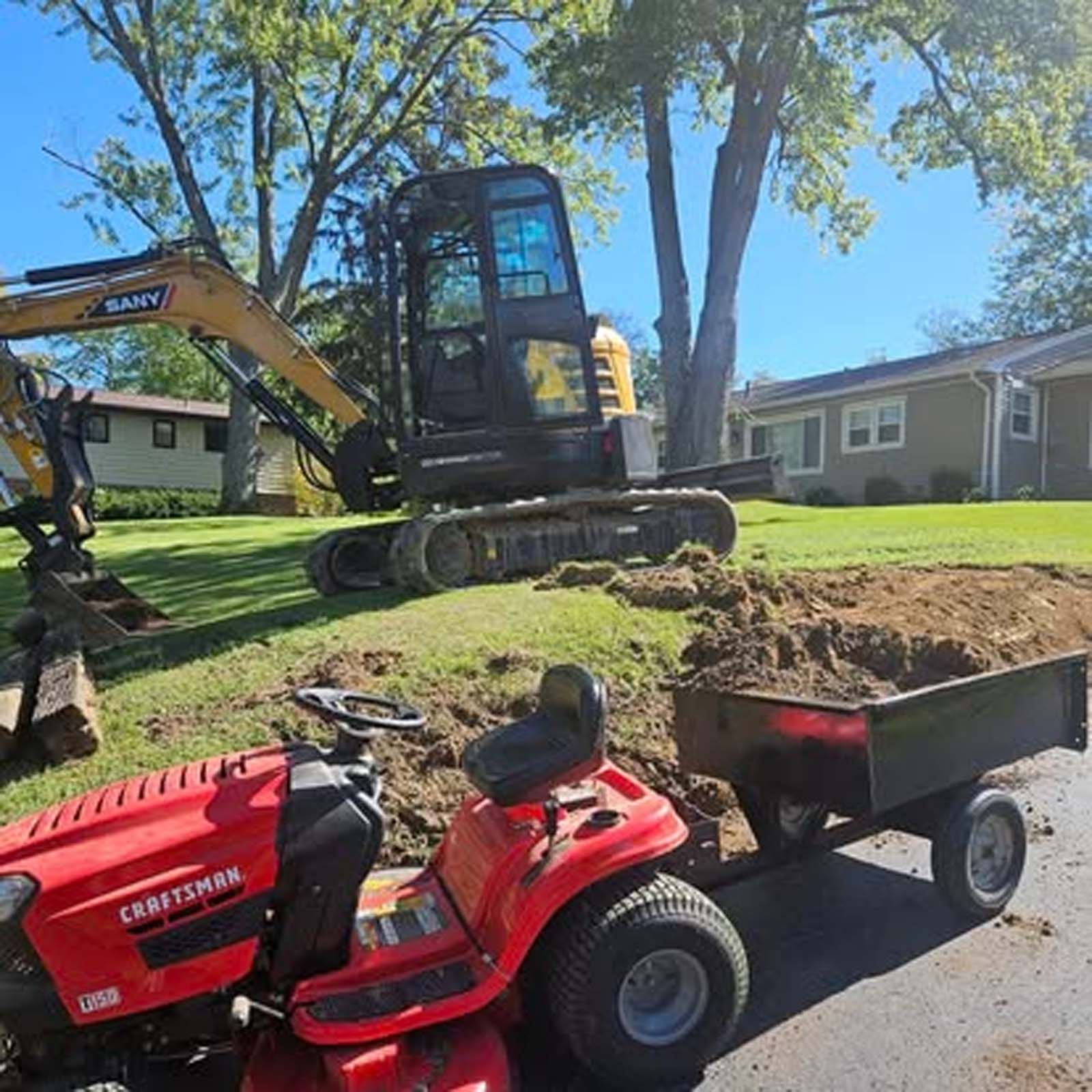A craftsman lawn mower with a trailer attached to it