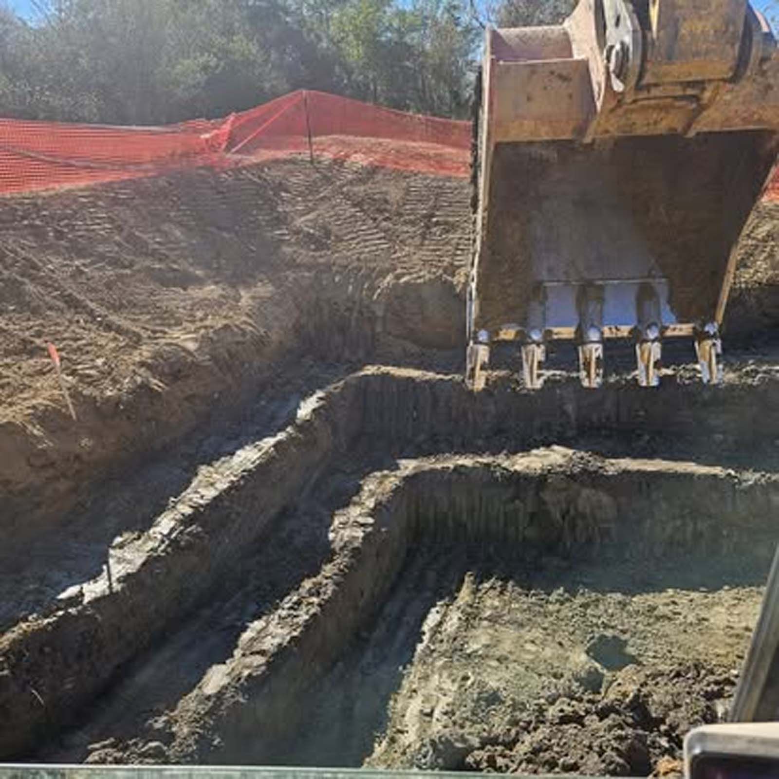 A bulldozer is digging a hole in the ground