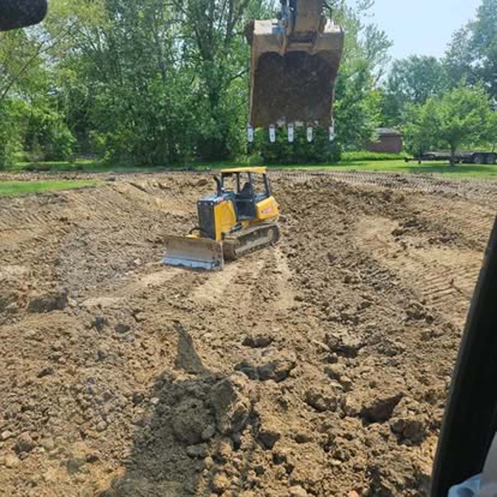 A pile of concrete blocks sitting on top of a dirt road.