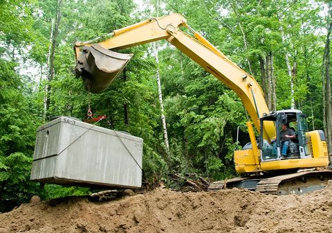 Installing Septic Tank with Excavator at Construction Site — Elkton, MD — Mid Atlantic Septic