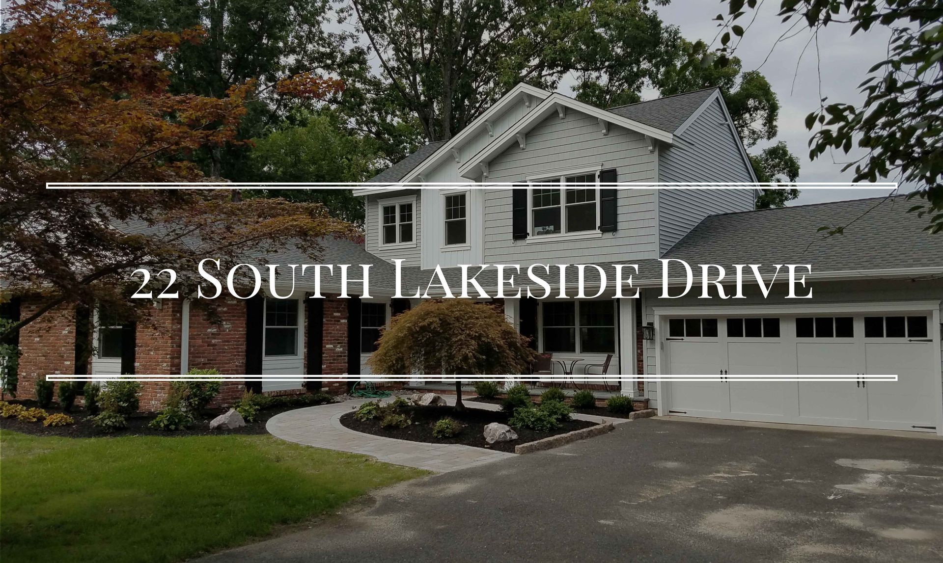 A large brick house with a white garage door is for sale on 22 south lakeside drive.