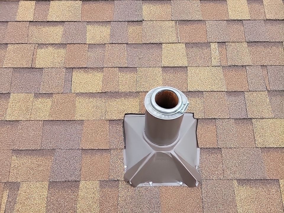 a house with two garages and a large lawn