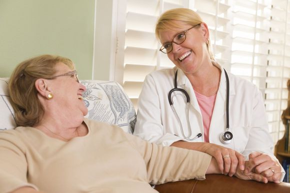old woman talking to a doctor