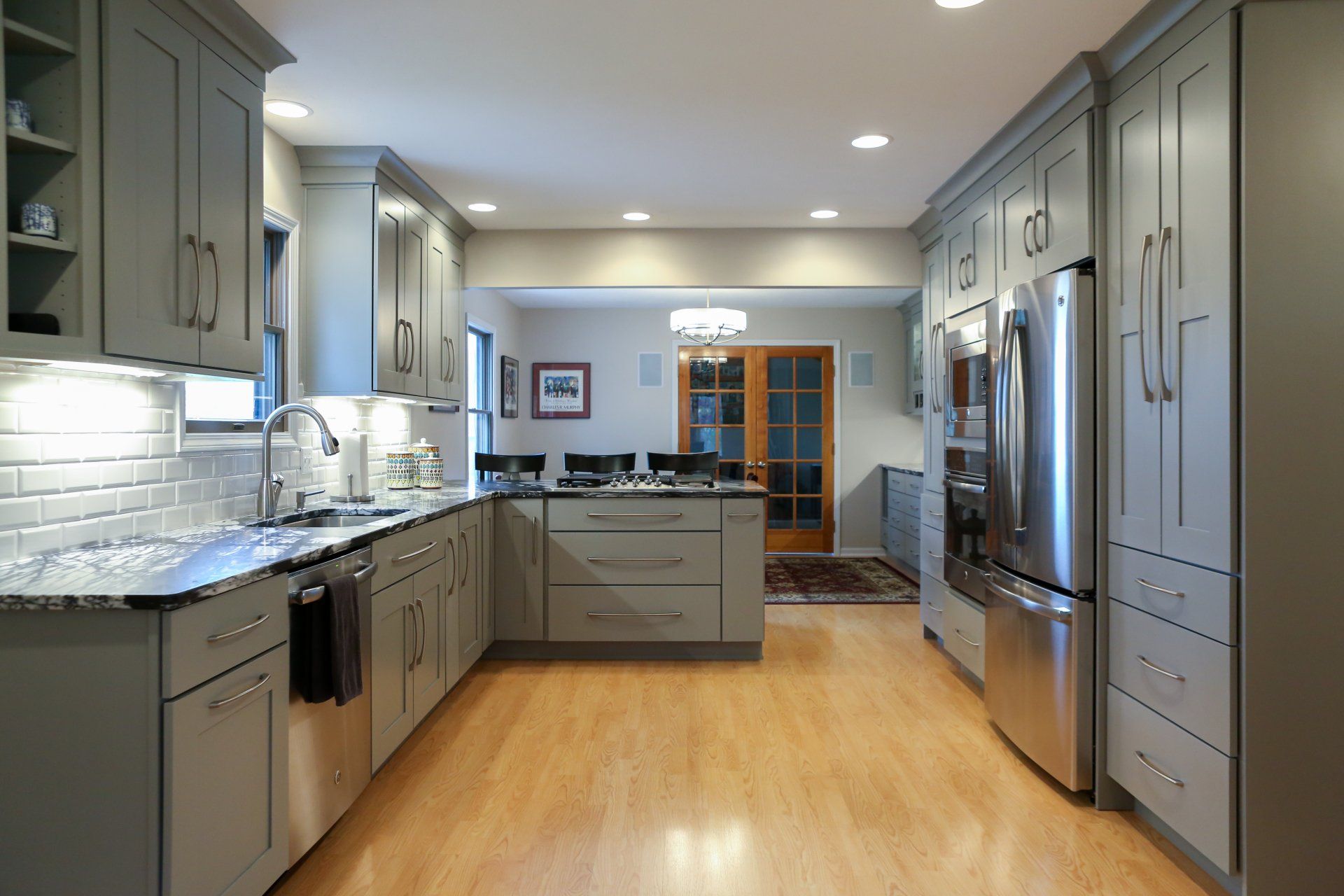 Kitchen Renovation — Kitchen with Silver Colored Cabinetry in Traverse City, MI