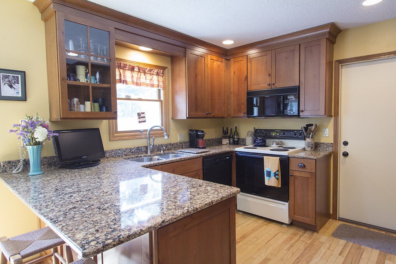 Modern Countertops — Kitchen with Computer Monitor on Countertop  in Traverse City, MI