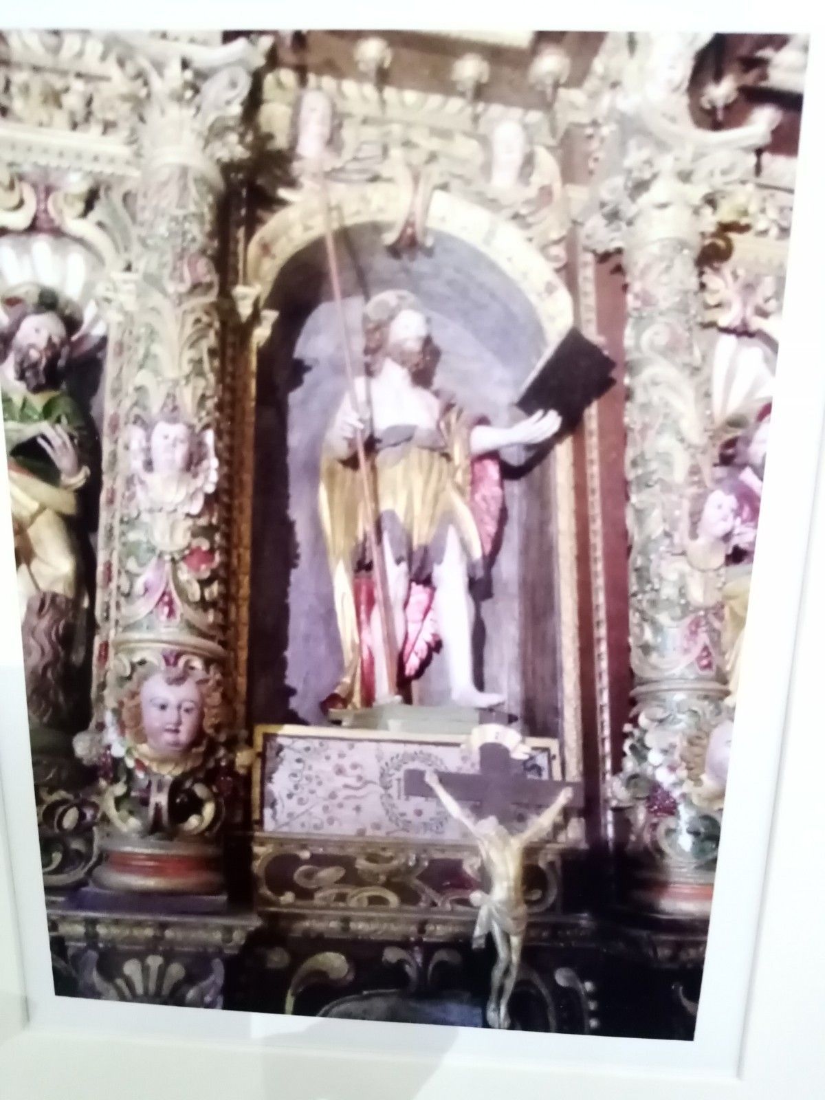 A picture of an altar with a statue of jesus on it