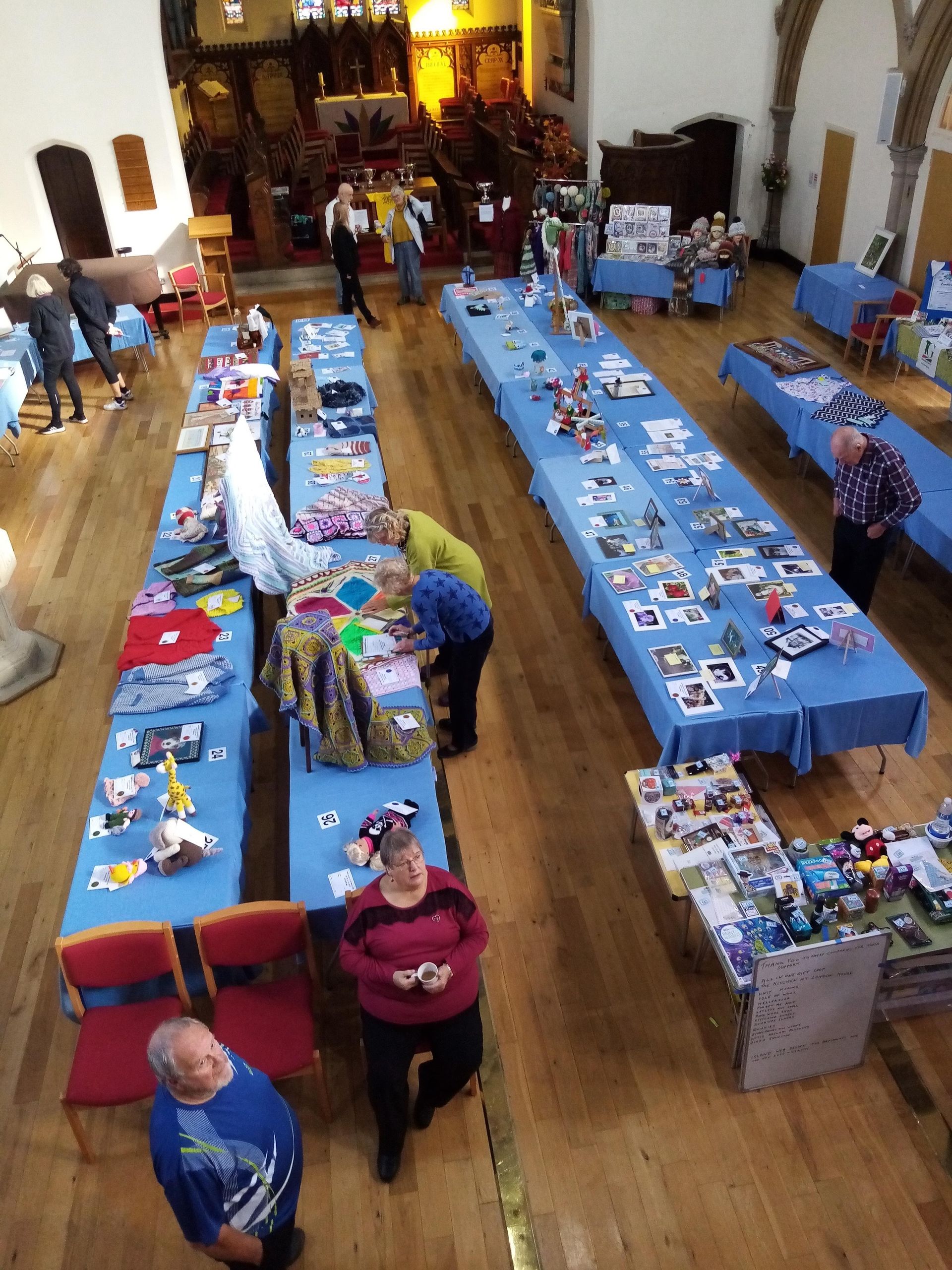An aerial view of a large room with tables and chairs