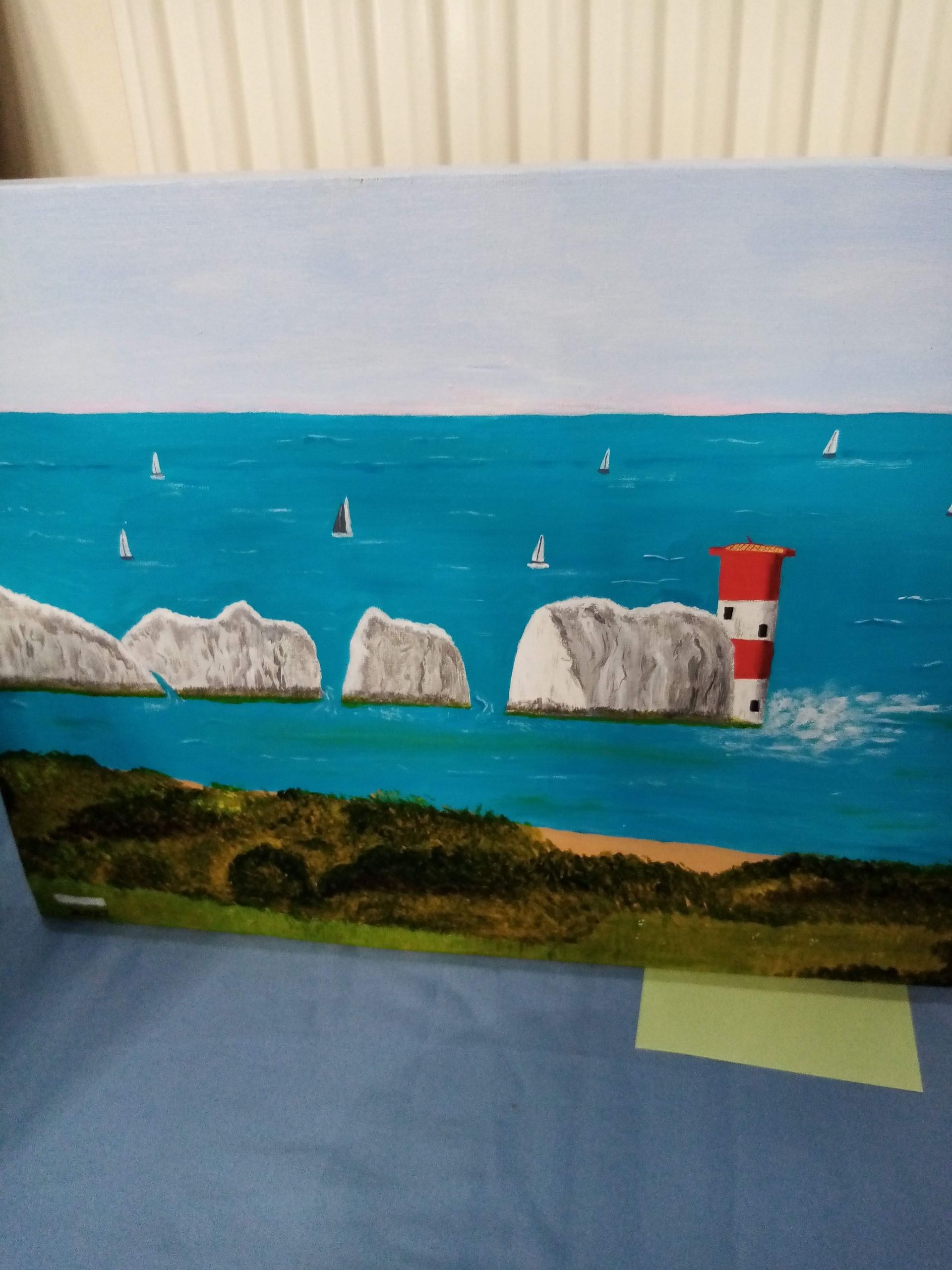 A painting of a lighthouse in the middle of the ocean