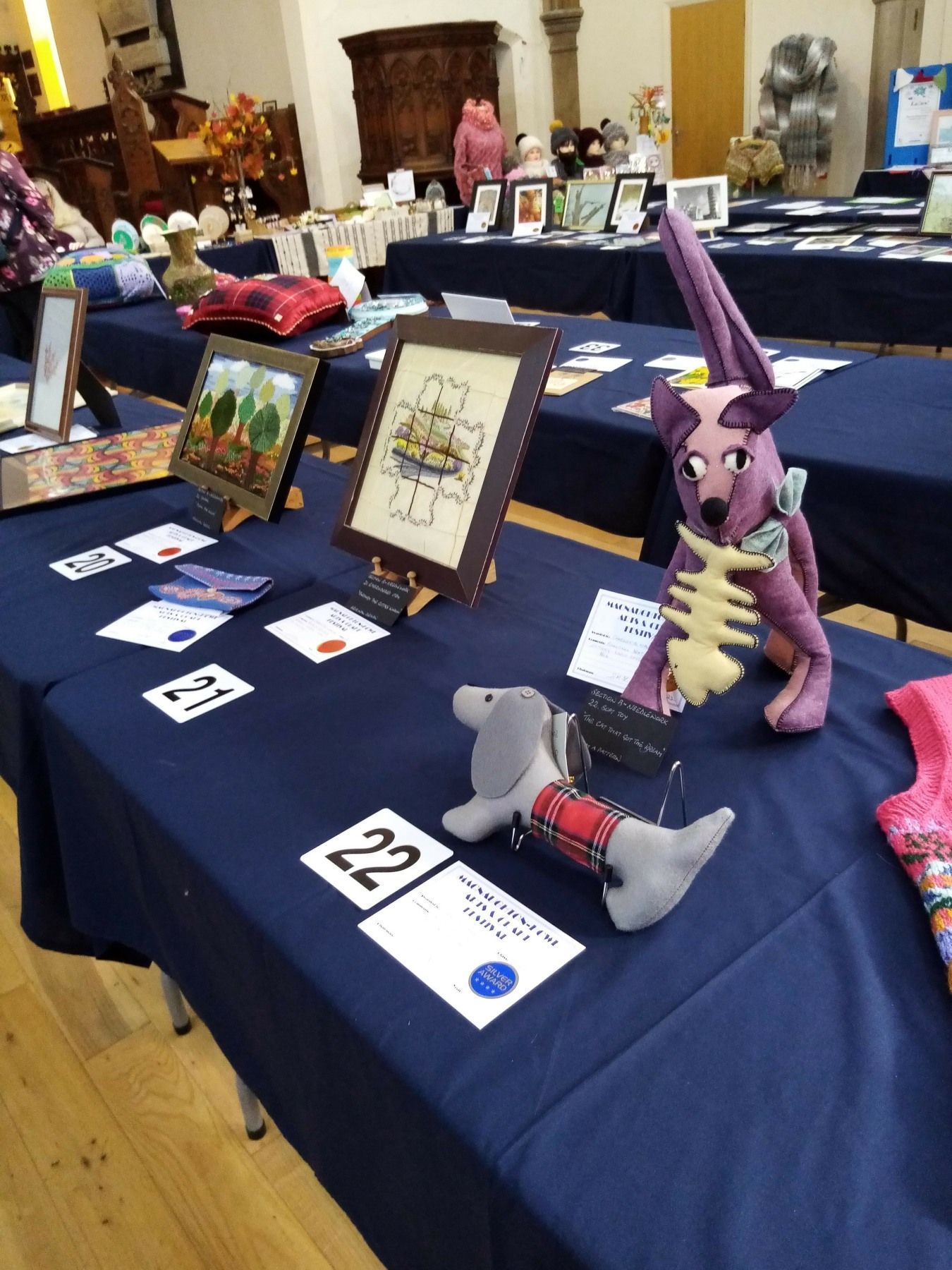 A table with a stuffed animal on it with the number 22 on it