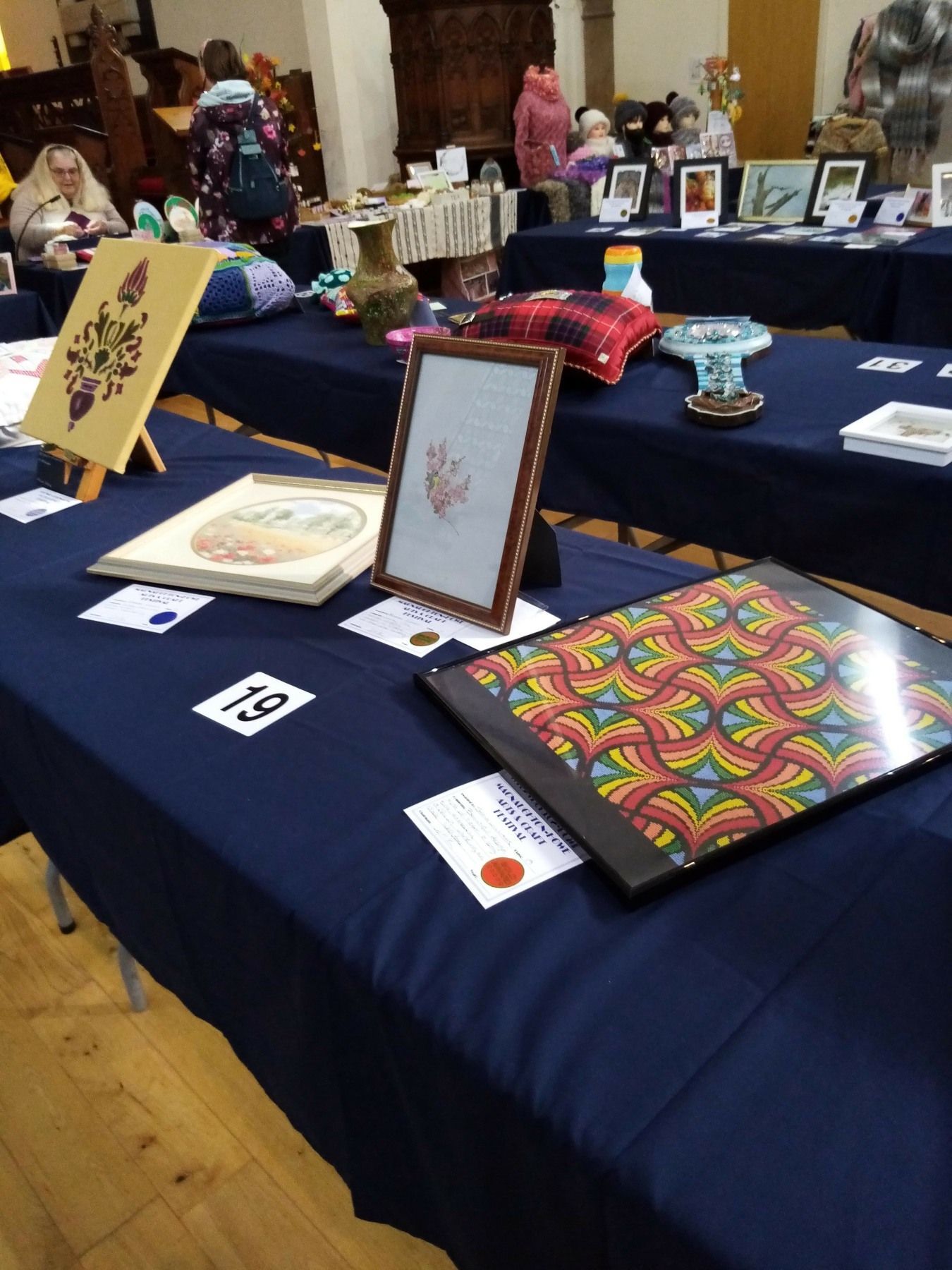 A table with a blue table cloth and a picture on it