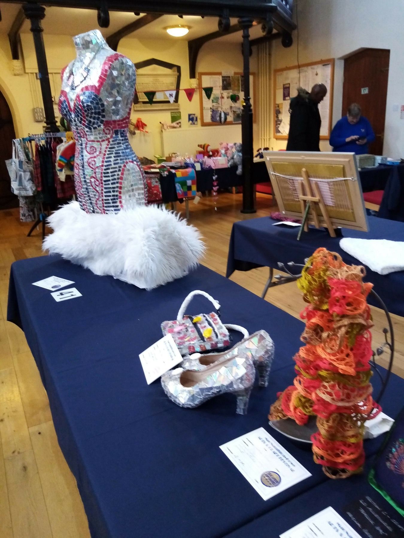 A table with a purse and shoes on it
