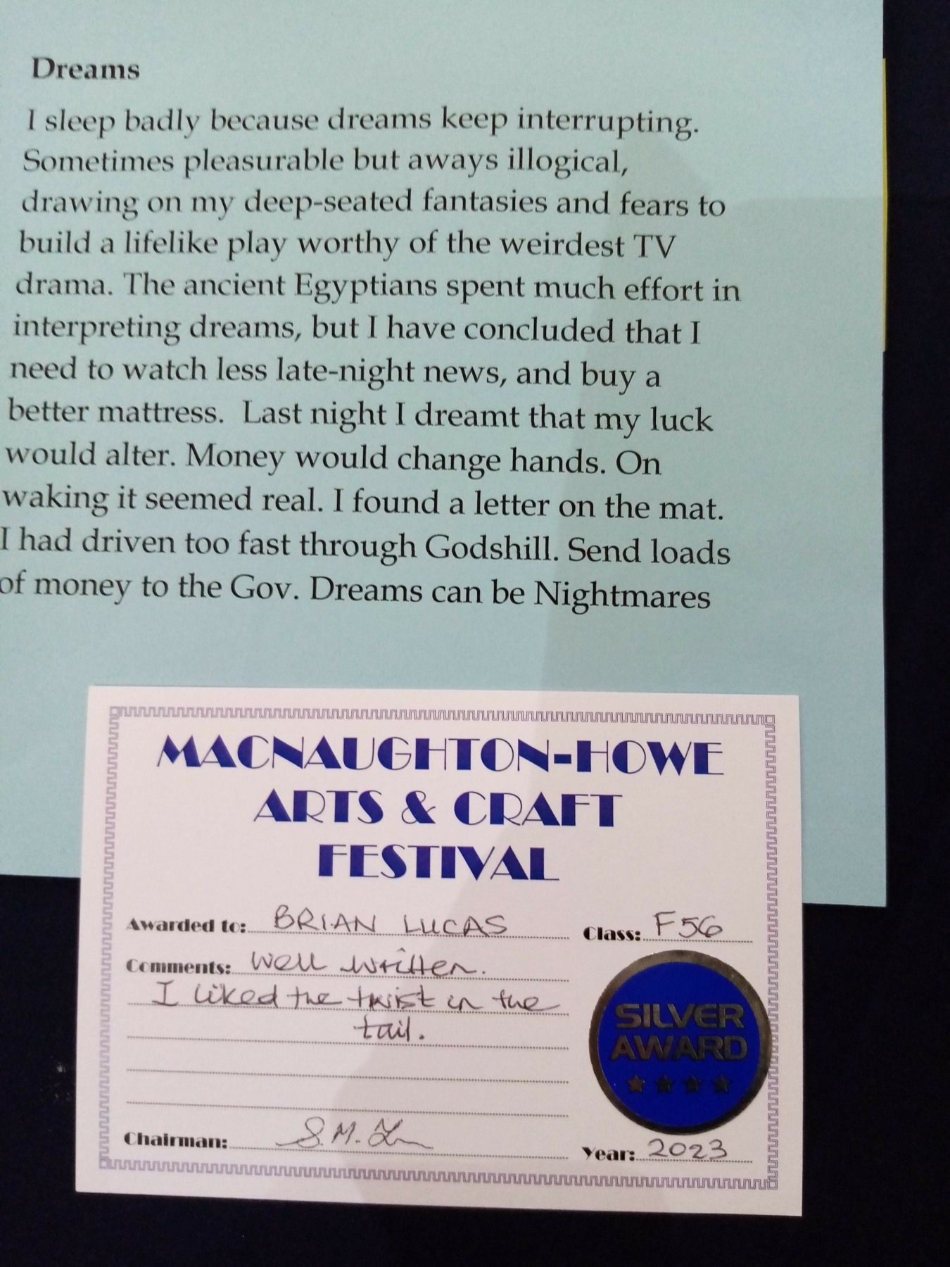 A piece of paper that says dreams on it