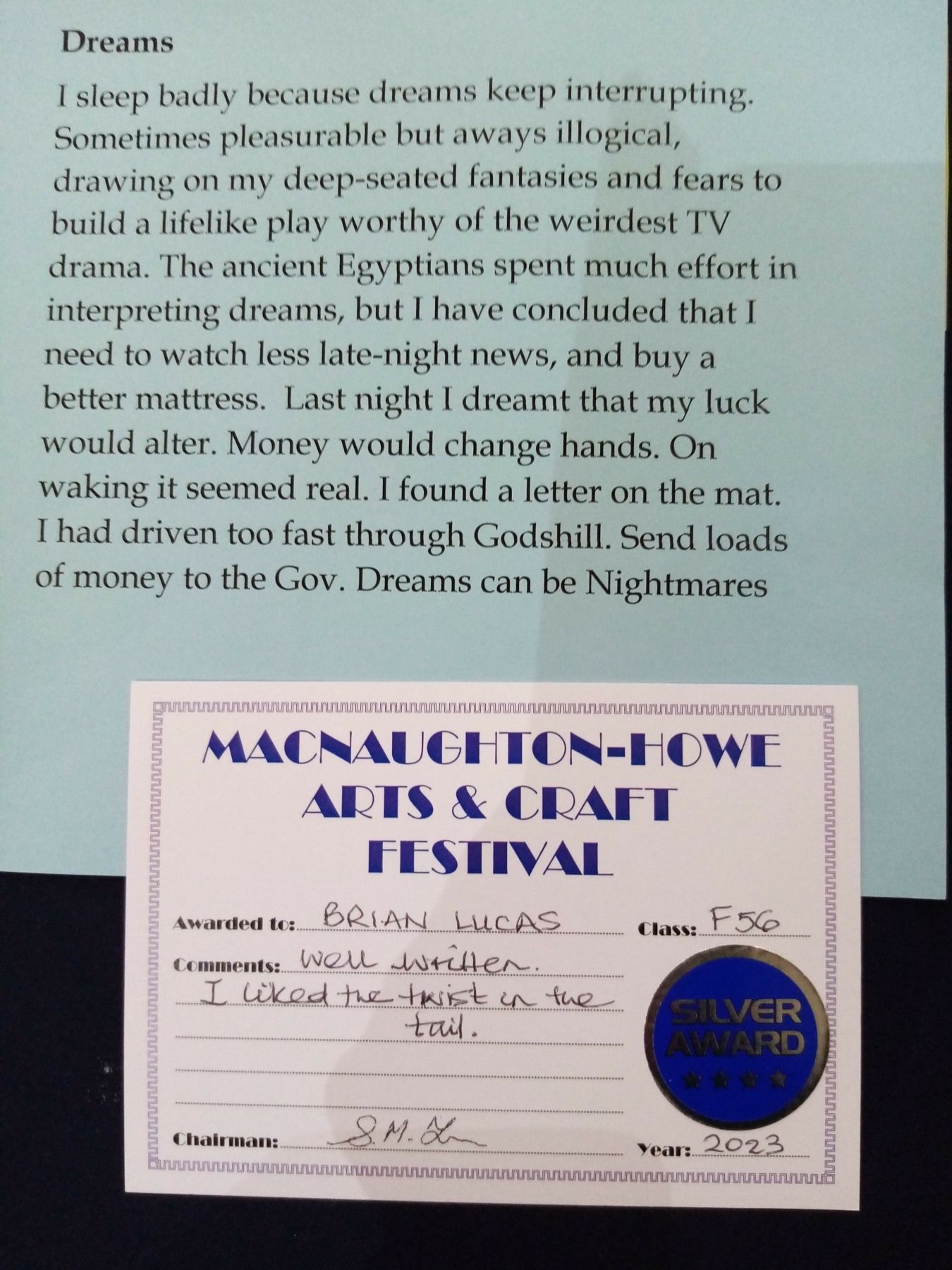 A piece of paper that says dreams on it