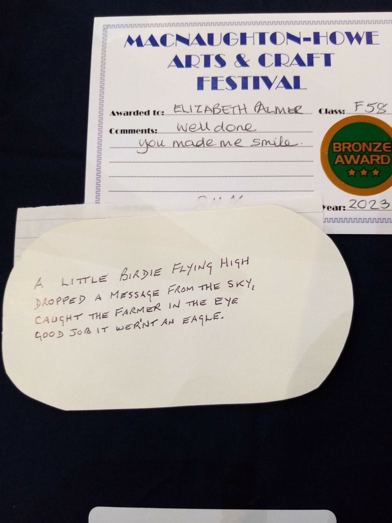 A piece of paper that says arts and craft festival on it