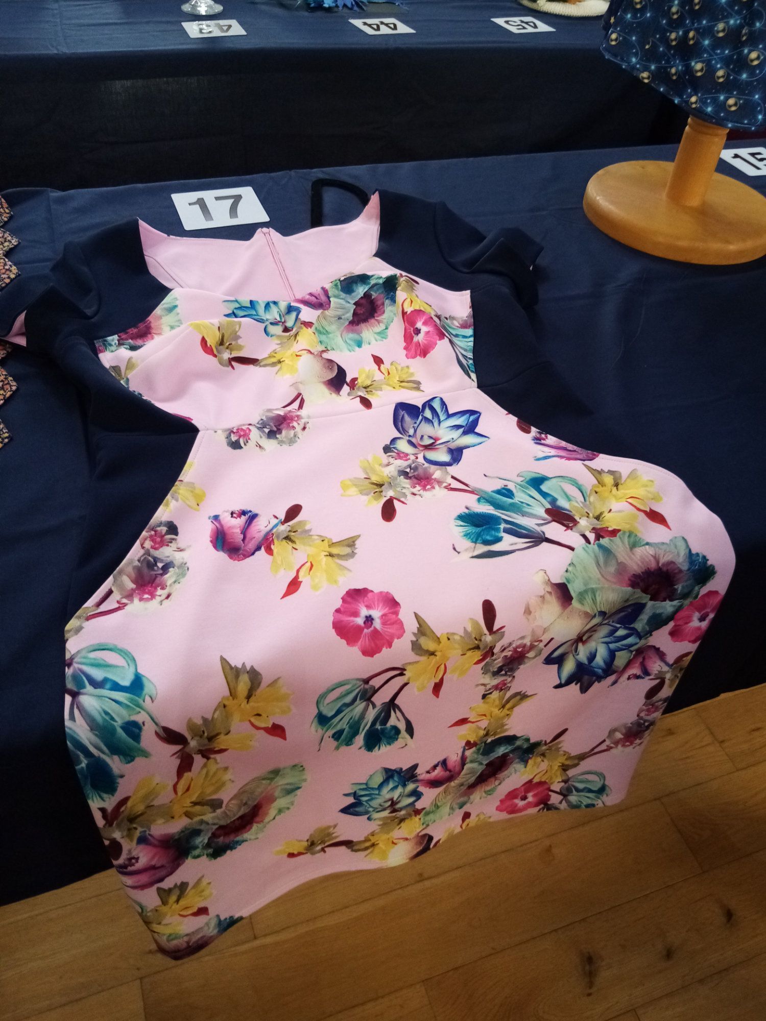 A pink floral dress with the number 17 on it