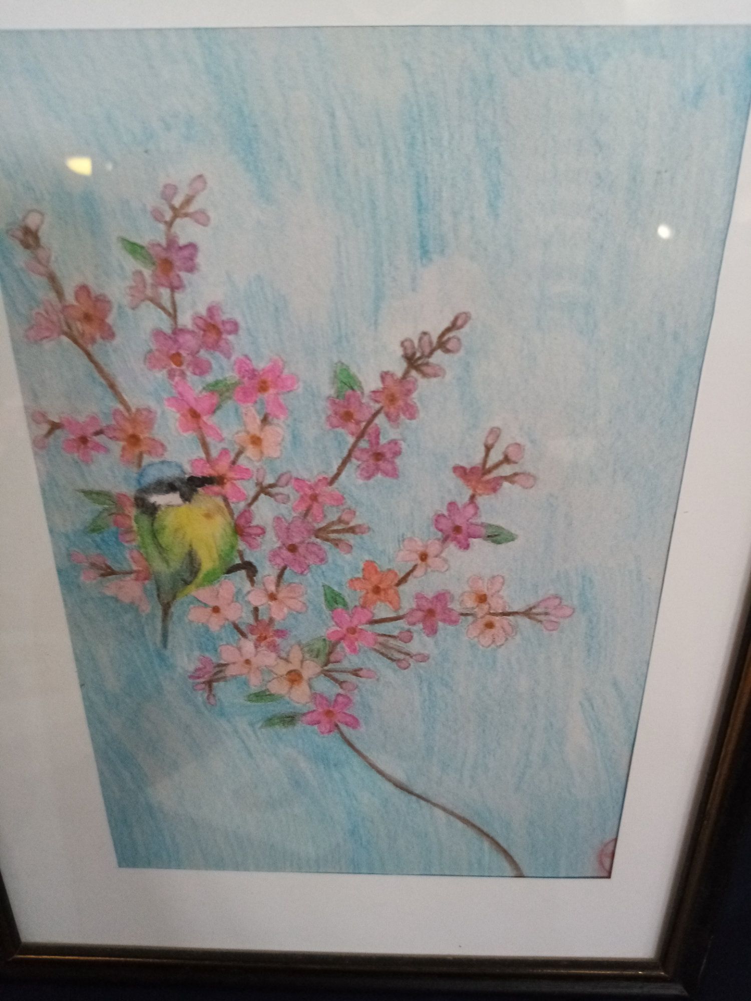 A painting of a bird sitting on a branch of flowers
