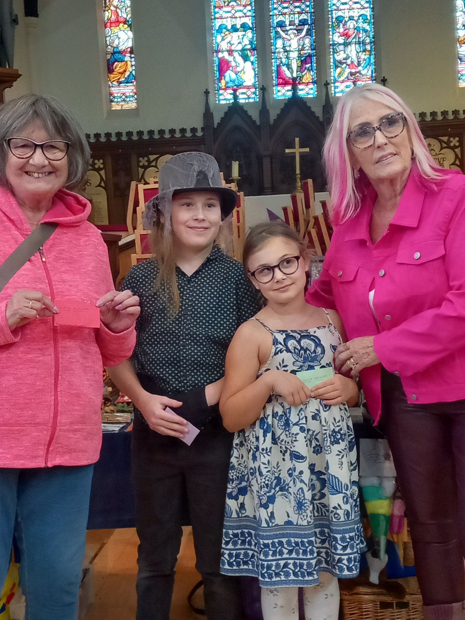 A group of people are posing for a picture in a church.