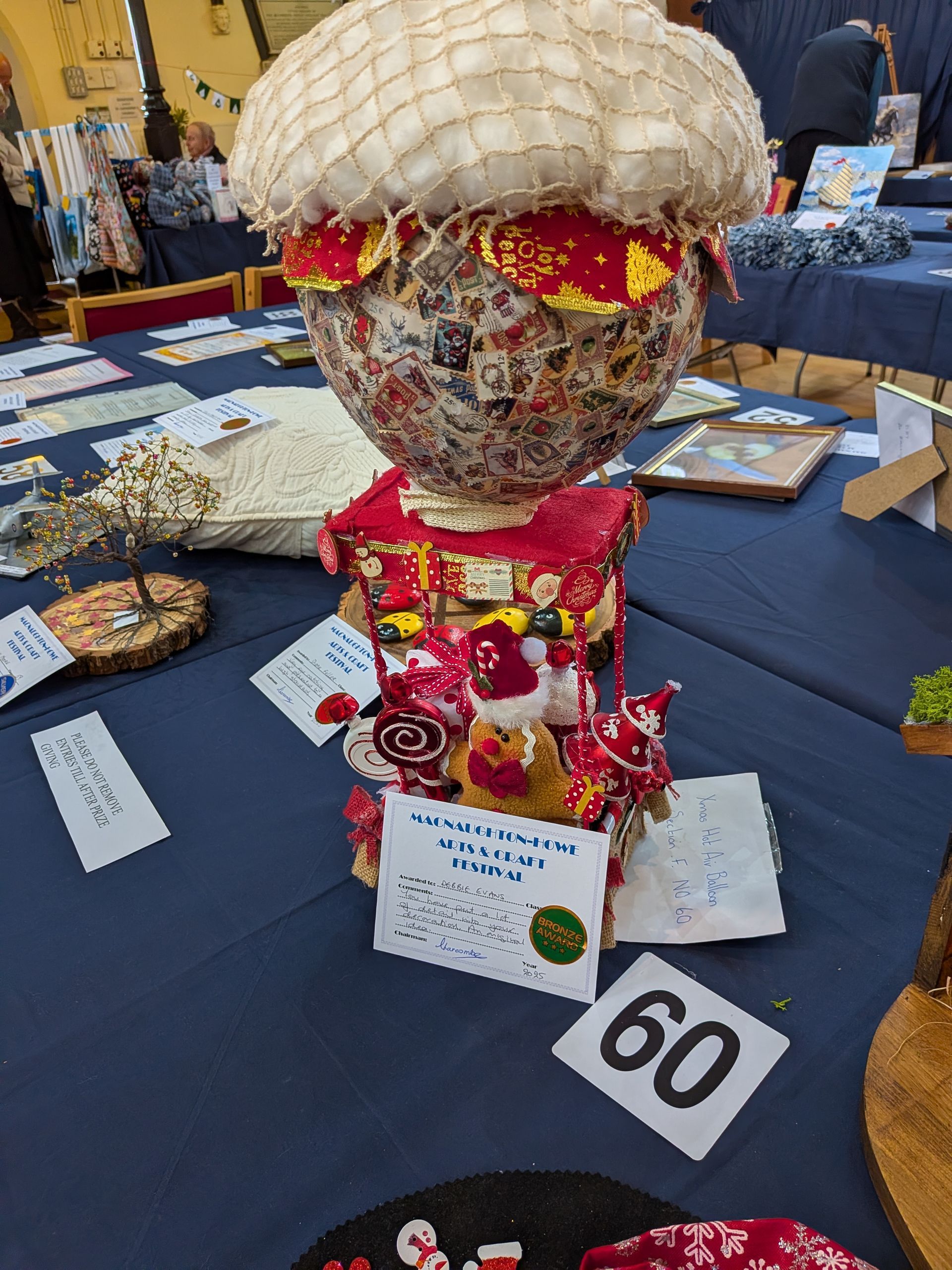 Craft display: Mushroom-shaped sculpture with a shop base, decorated in red and white.