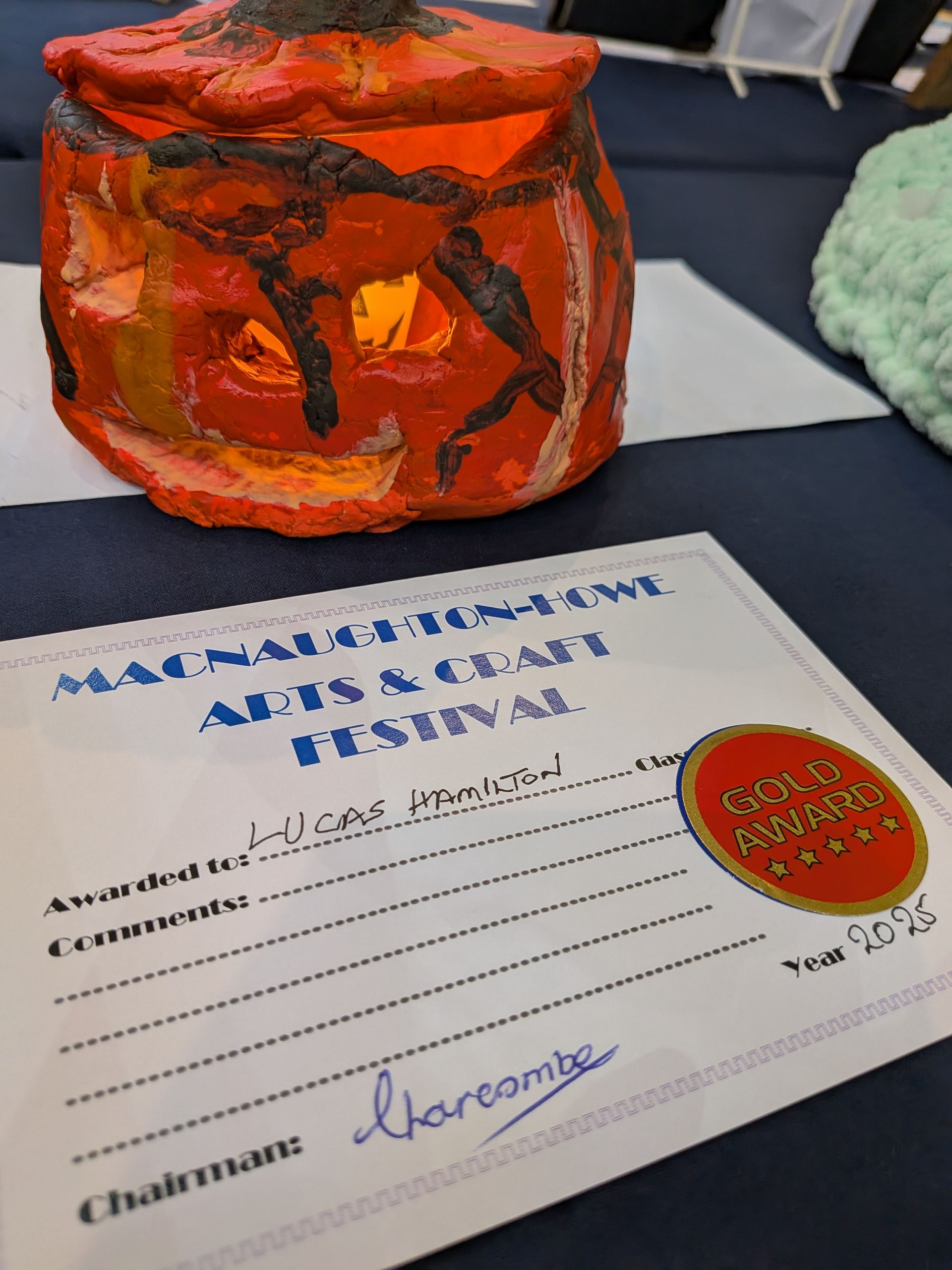 Pumpkin-shaped lantern with a gold star award from the Macnaughtan Arts & Craft Festival.