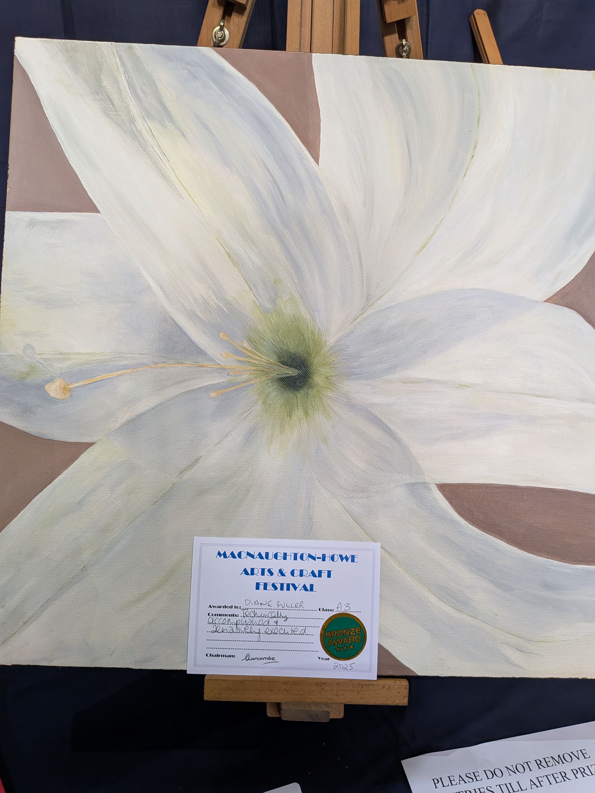 Painting of a large white flower with a green center, set against a tan background, with a certificate at the bottom.