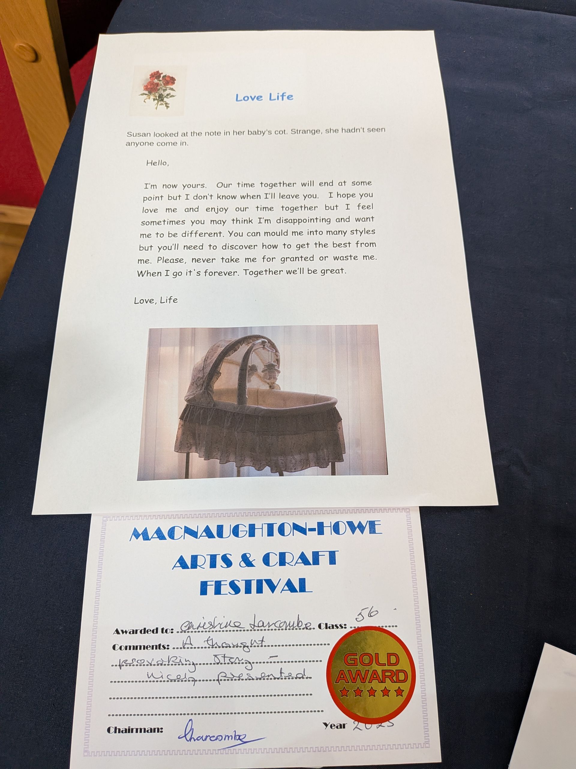 A letter and festival certificate with a picture of a decorative basket.