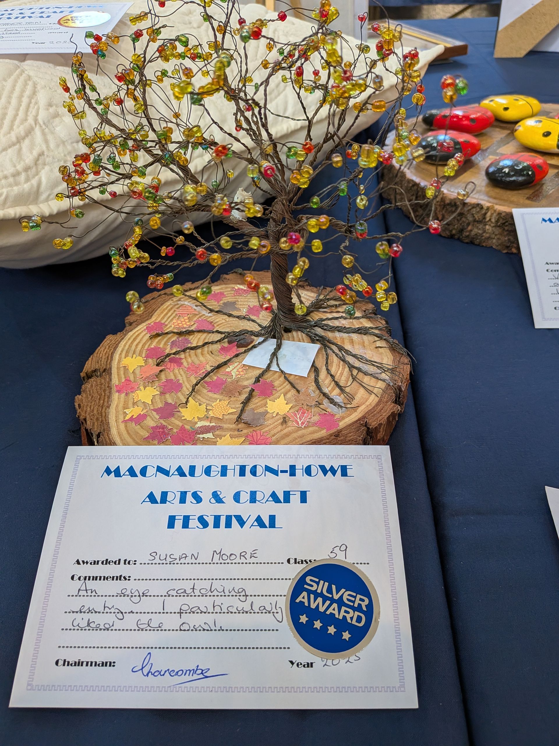 A beaded tree sculpture with a Silver Award from a craft festival.