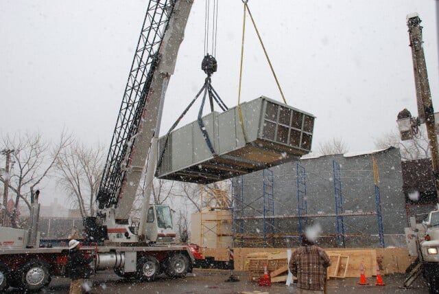 Crane lifting metal - AC repairs in Trinidad, CO