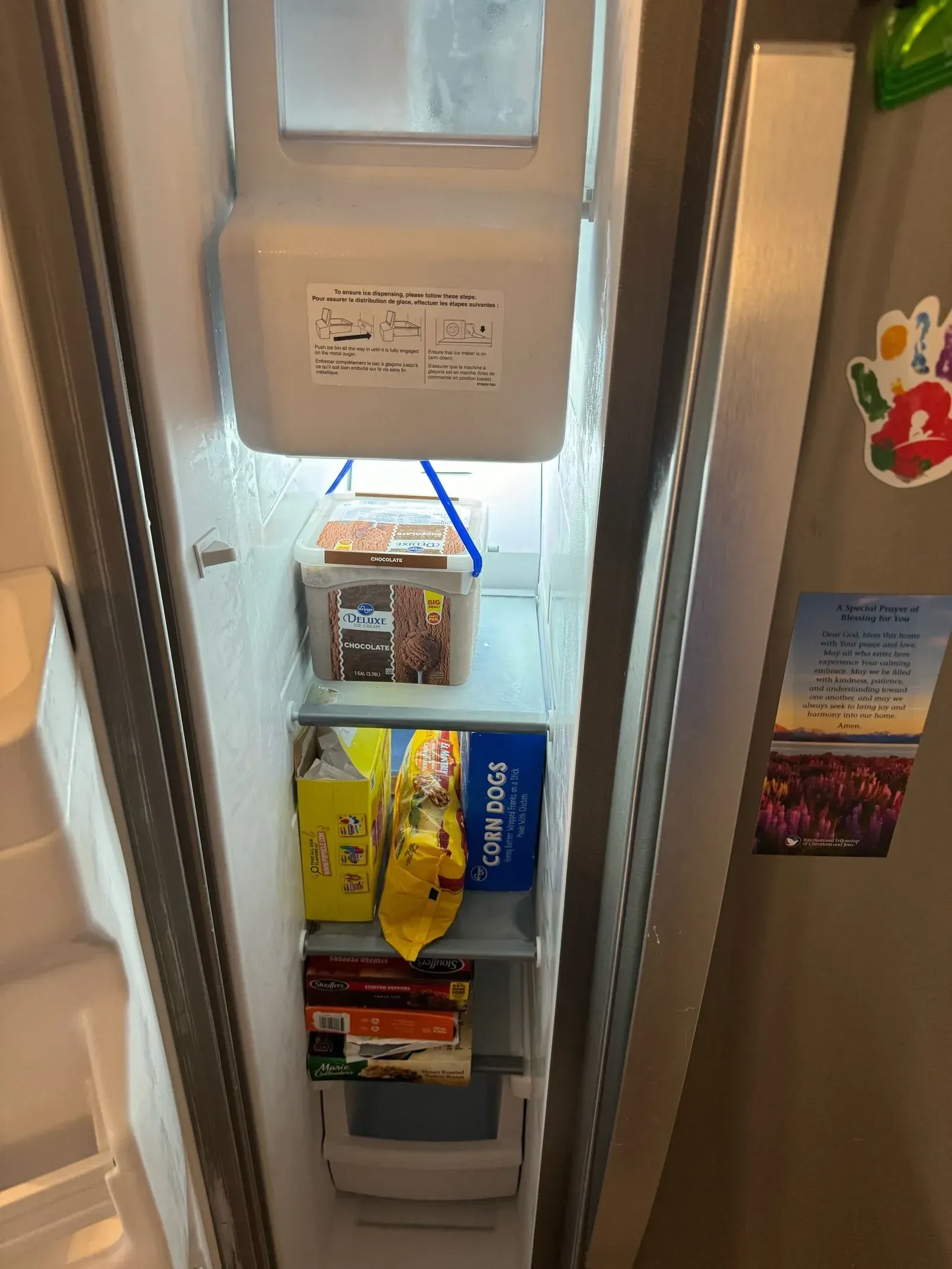 The inside of a refrigerator with a lot of food in it.
