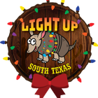 Armadillo decorated with Christmas lights in South Texas, wooden background, red bow, colorful lights.