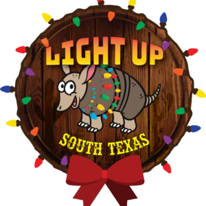 Armadillo decorated with Christmas lights in South Texas, wooden background, red bow, colorful lights.