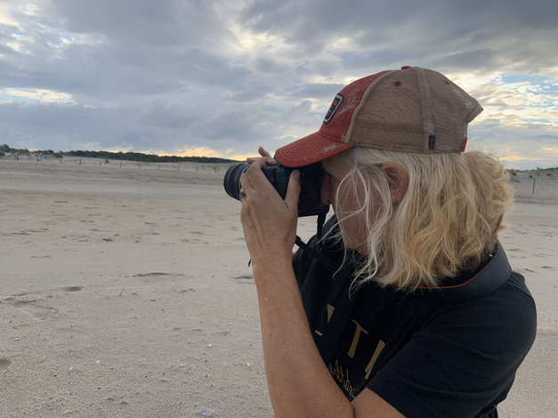 Owner Mary Bryan photographing at Assateague
