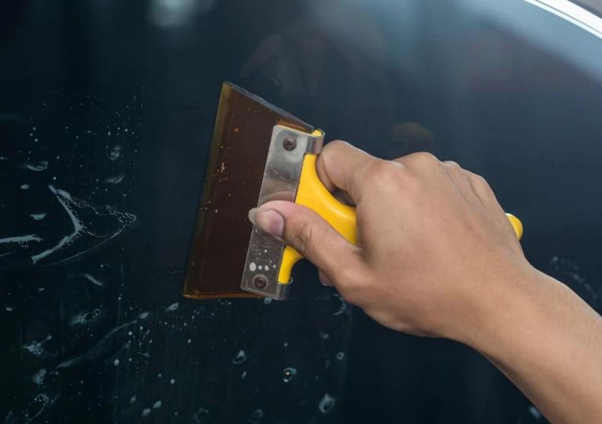 High-quality window filming tools placed on a car