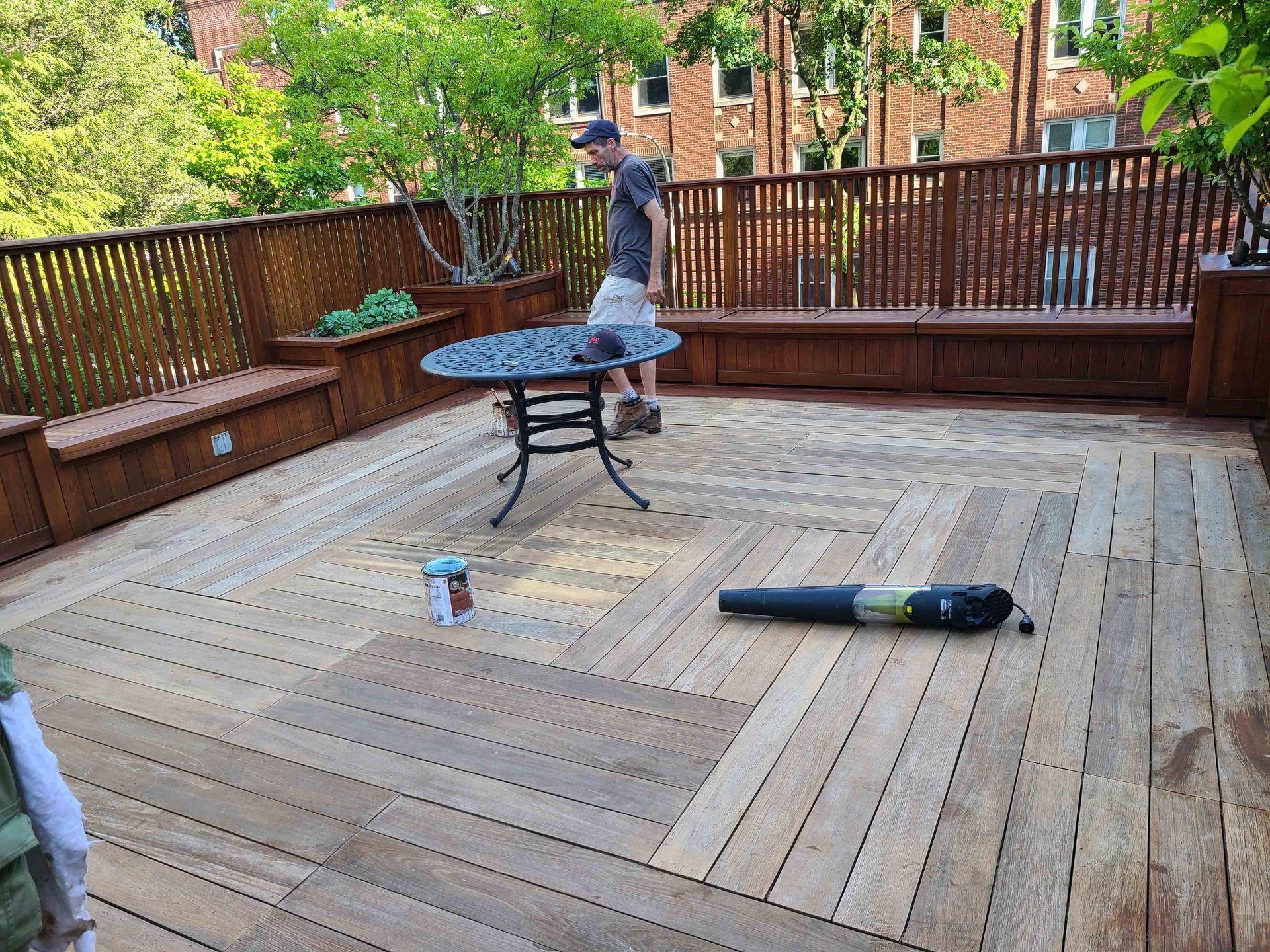 Man is Standing on a Wooden Deck — Chicago, IL — McMaster Painting