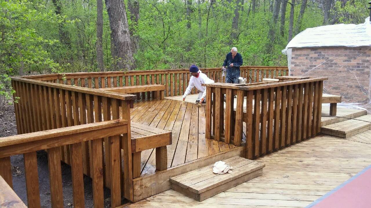 Two Men Are Cleaning a Wooden Deck — Chicago, IL — McMaster Painting