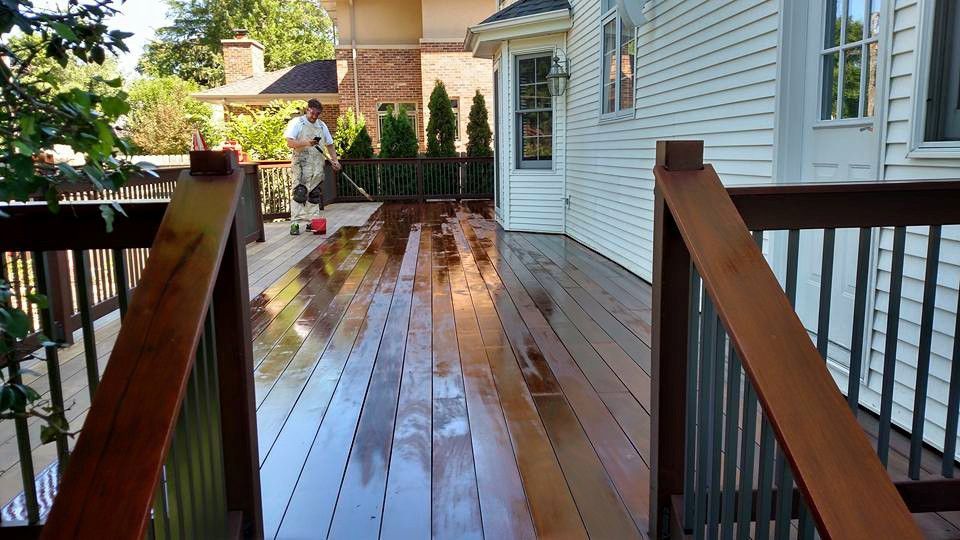 Man is Cleaning a Wooden Deck — Chicago, IL — McMaster Painting