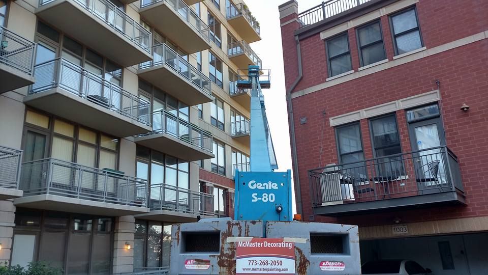 Crane In Front Of A Tall Building — Chicago, IL — McMaster Painting