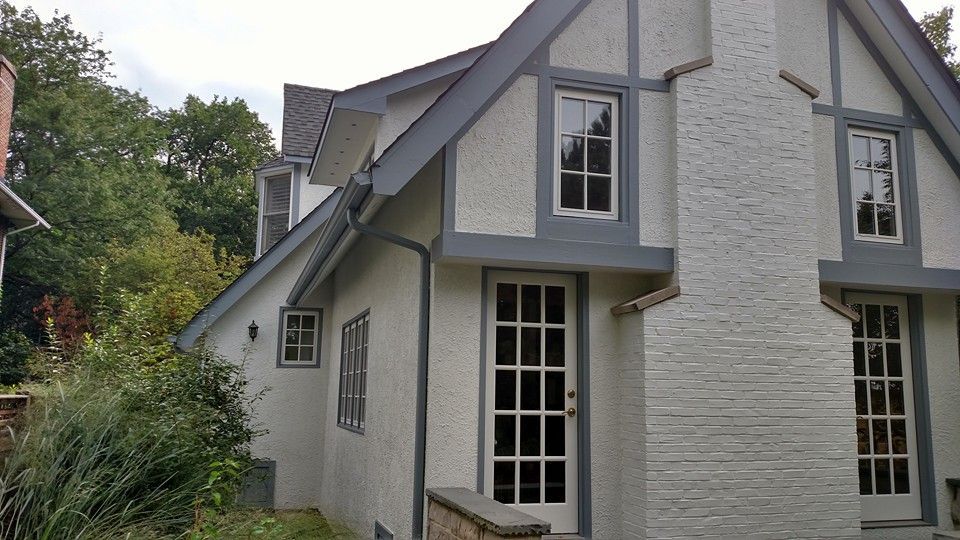 A White House With A Gray Trim And A Chimney — Chicago, IL — McMaster Painting