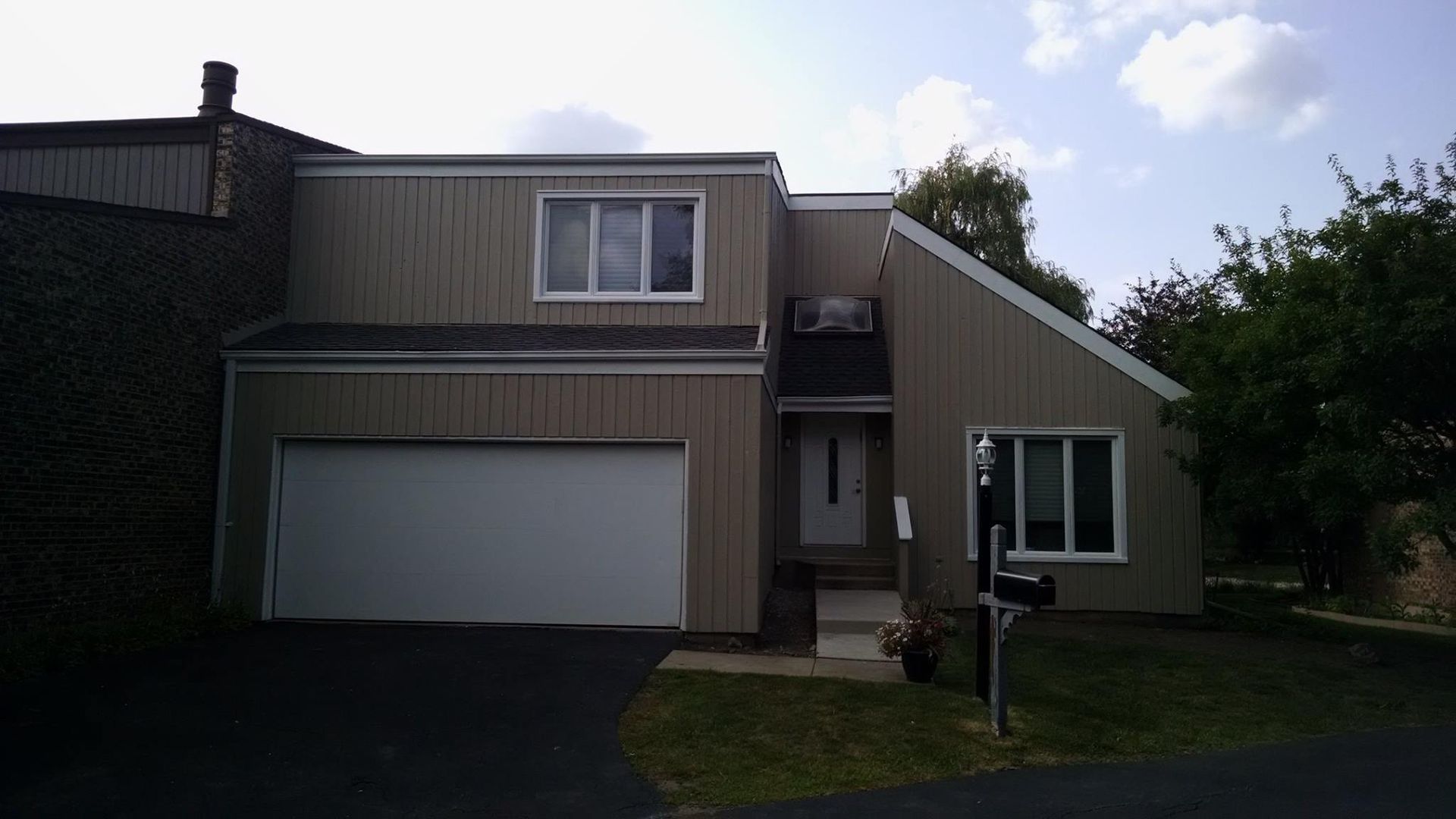 A House With A Garage And A Mailbox In Front Of It — Chicago, IL — McMaster Painting
