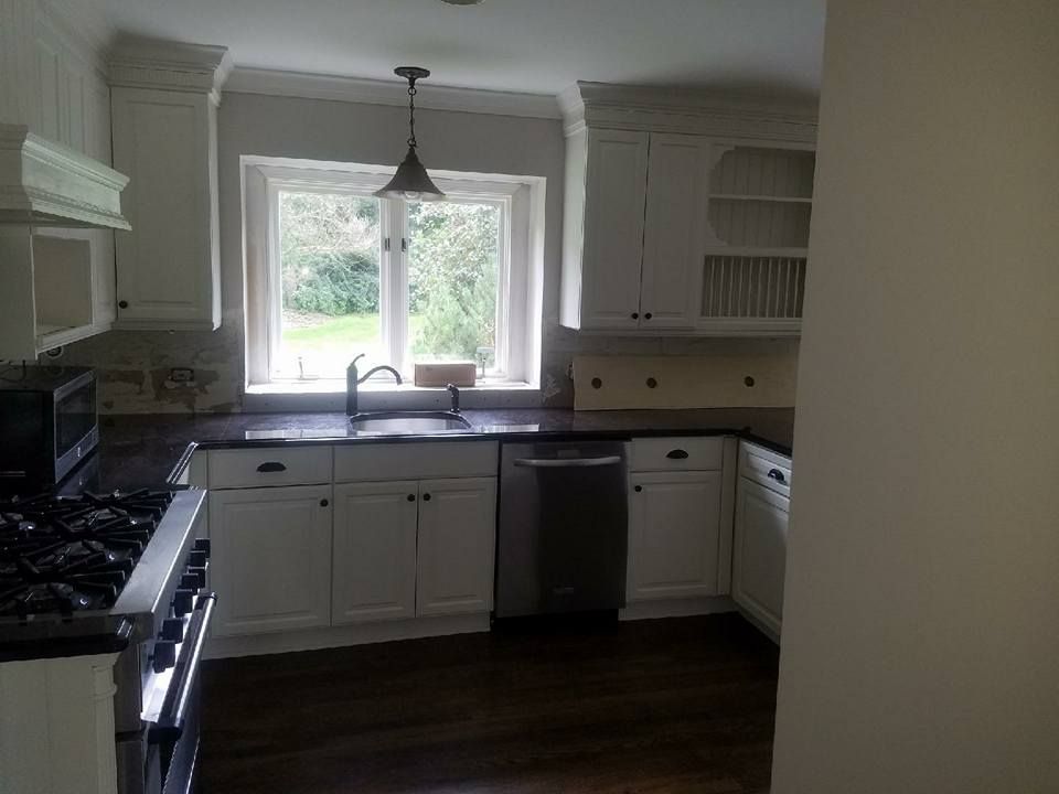 Kitchen with White Cabinets and Stainless Steel Appliances — Chicago, IL — McMaster Painting