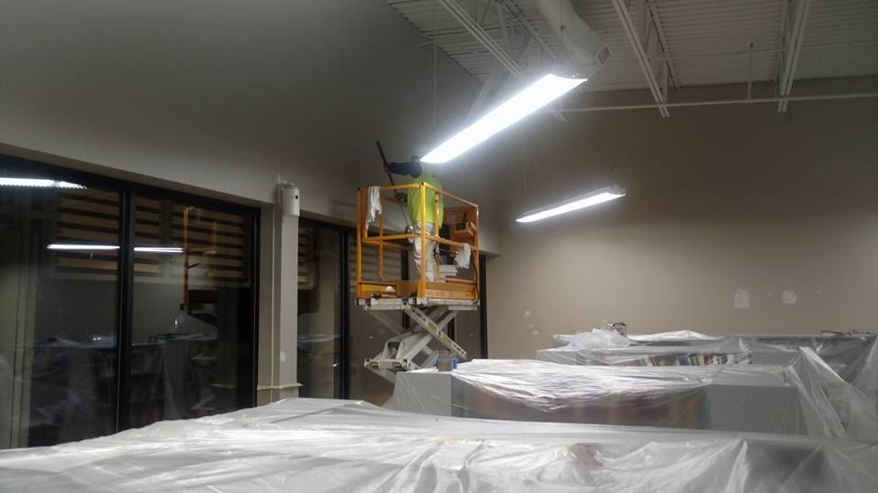 A Worker Finishing the Paint - Chicago, IL - McMaster Painting